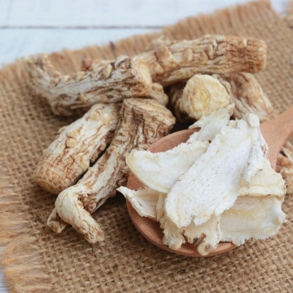 Dried Angelica Root in a Wooden Chopping Board
