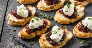 Appetizing Canape with Toasted Baguette, Onion Jam, Cream Cheese and Thyme