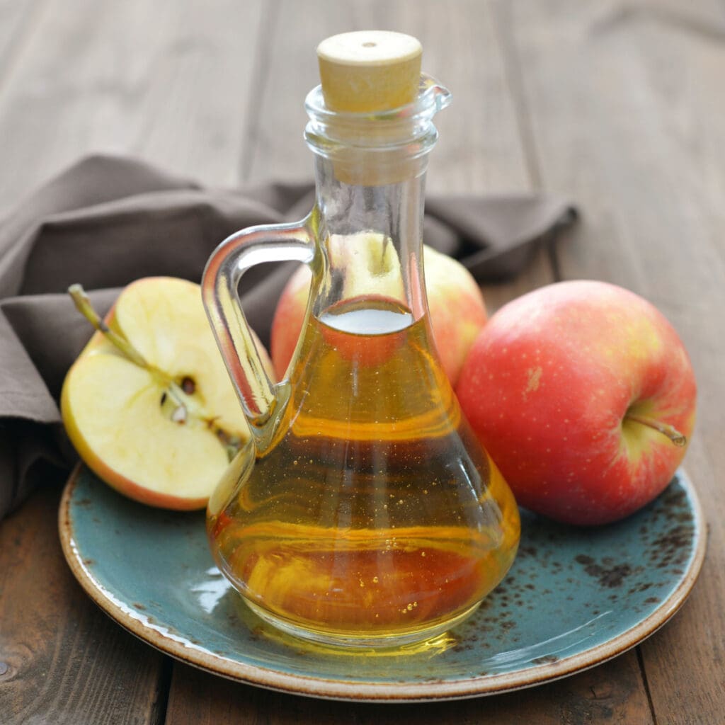 Fresh Apples and Apple Cider Vinegar in a Bottle