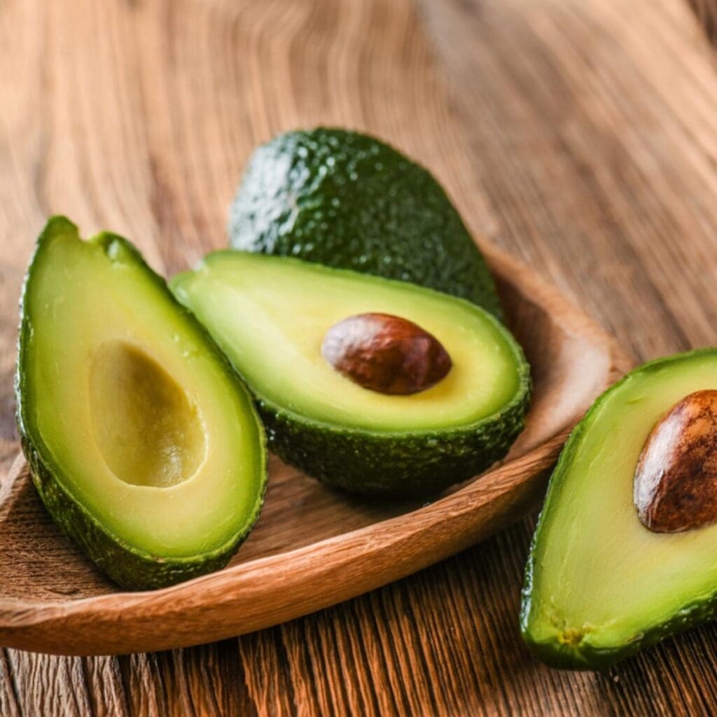 Avocadoes on a Wooden Bowl