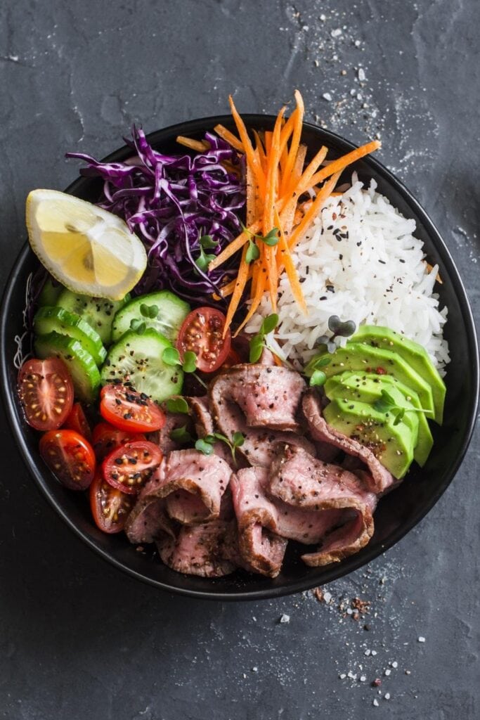 Steak and Rice bowl with Cucumber, Tomatoes and Avocados
