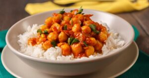 Bowl of Chickpea Curry with Rice and Herbs