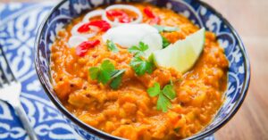 Bowl of Red Lentil Curry with Cream and Lime