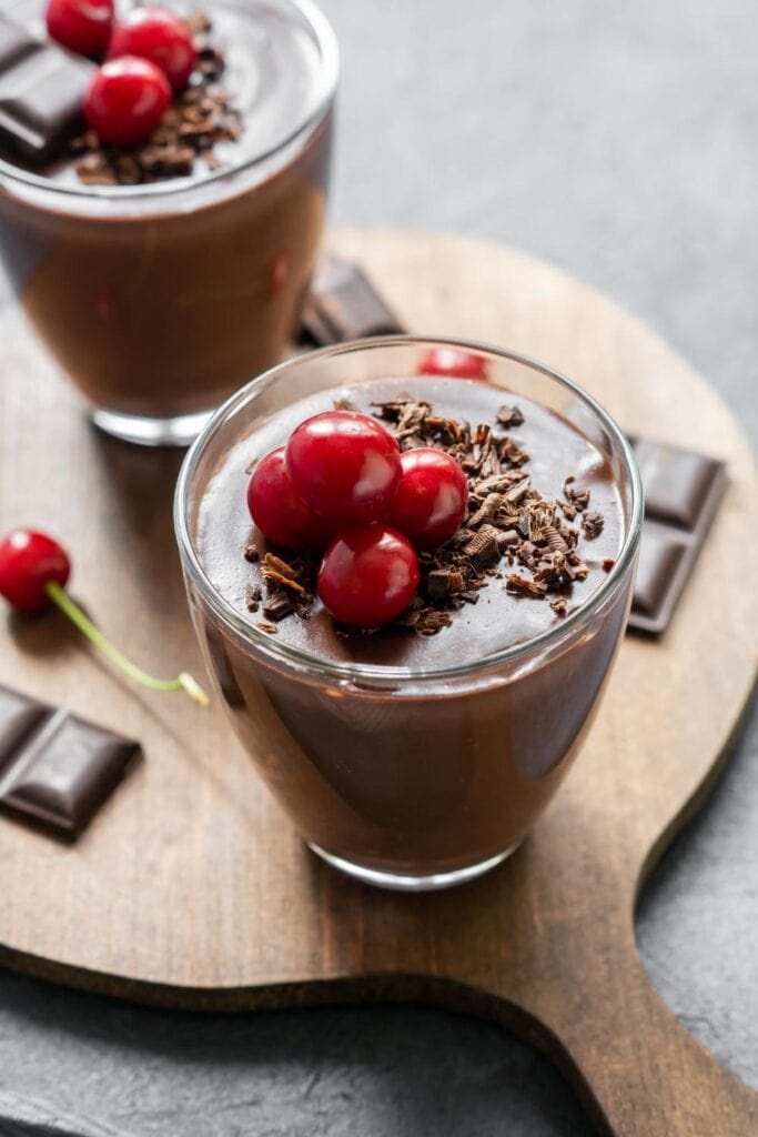 Chocolate pudding with coconut milk and cherries