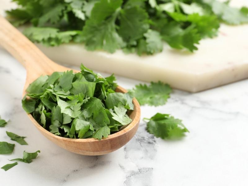 Chopped Cilantro in a Wooden Spoon
