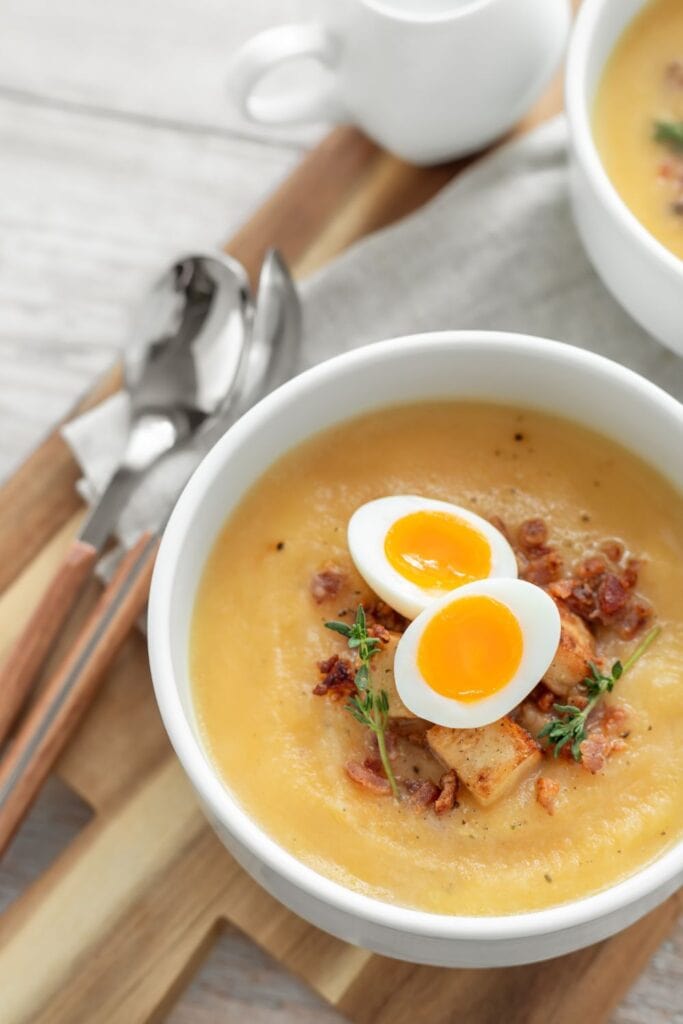 Creamy Celery Root Soup with Hard Boiled Egg, Bacon, and Croutons