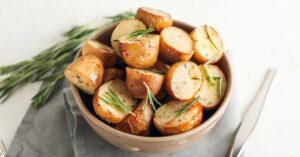 Homemade Baked Potatoes with Herbs in a Bowl