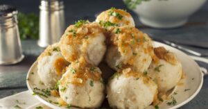 Homemade German Potato Dumplings with Butter Sauce and Herbs