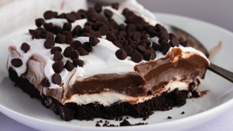 Homemade Oreo Lasagna with Chocolate Chips in a White Plate