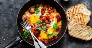 Homemade Shakshuka with Baked Sweet Peppers, Chickpeas and Bread