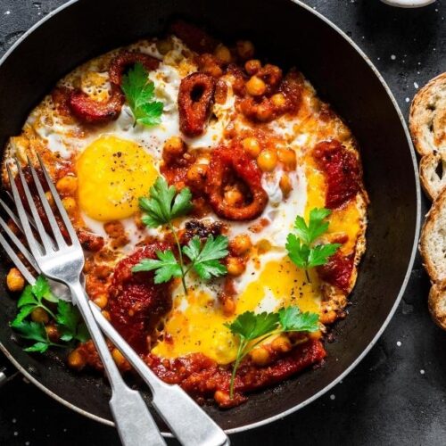 https://insanelygoodrecipes.com/wp-content/uploads/2022/08/Homemade-Shakshuka-with-Baked-Sweet-Peppers-Chickpeas-and-Bread-500x500.jpg