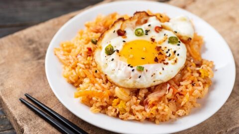 Kimchi Fried Rice with Egg in a White Plate