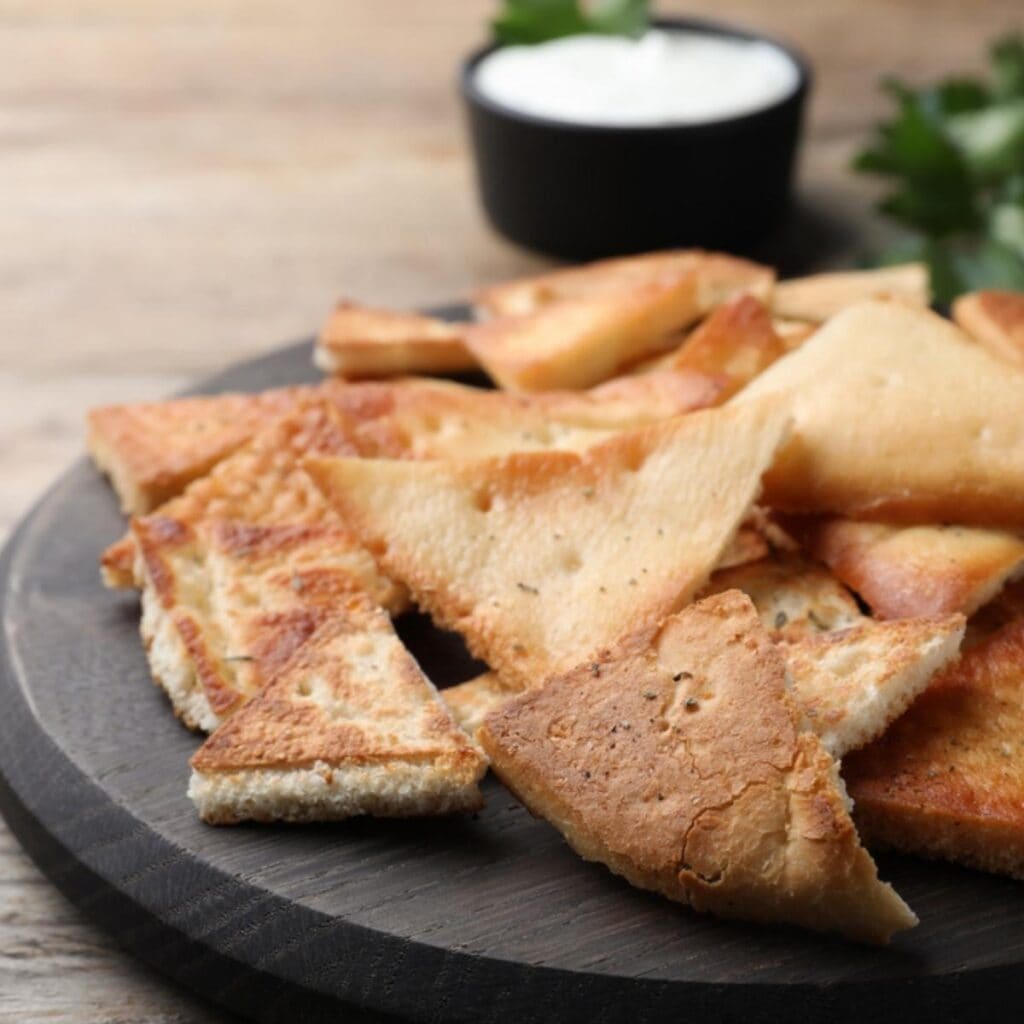 Pita Chips on a Wooden Chopping Board