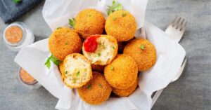 Risotto Rice Balls with Cheese and Tomato Sauce