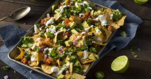 Sheet Pan Nachos with Avocados Tomatoes and Peppers