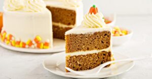 Slice of Sweet Pumpkin Cake with Cream Cheese and Decorated Candies