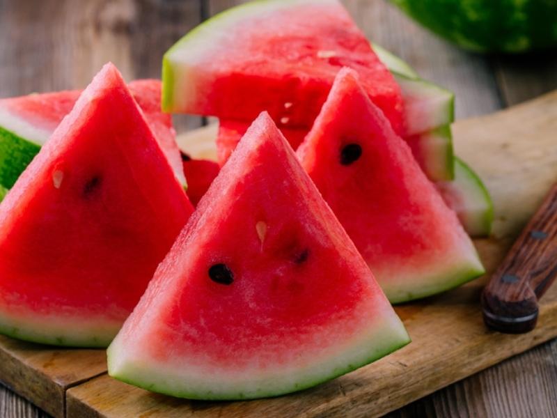 How to Tell If a Watermelon is Ripe (6 Ways): Slices of Watermelon in a Wooden Cutting Board