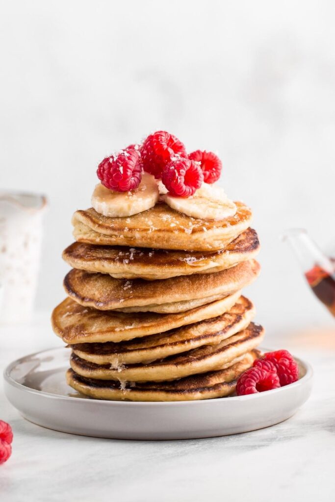 Soft and Fluffy Banana Pancakes with Raspberries