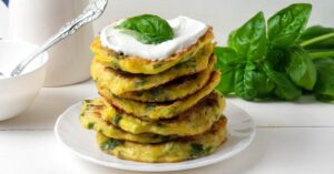 Stacked Homemade Zucchini Fritters with Whipped Cream