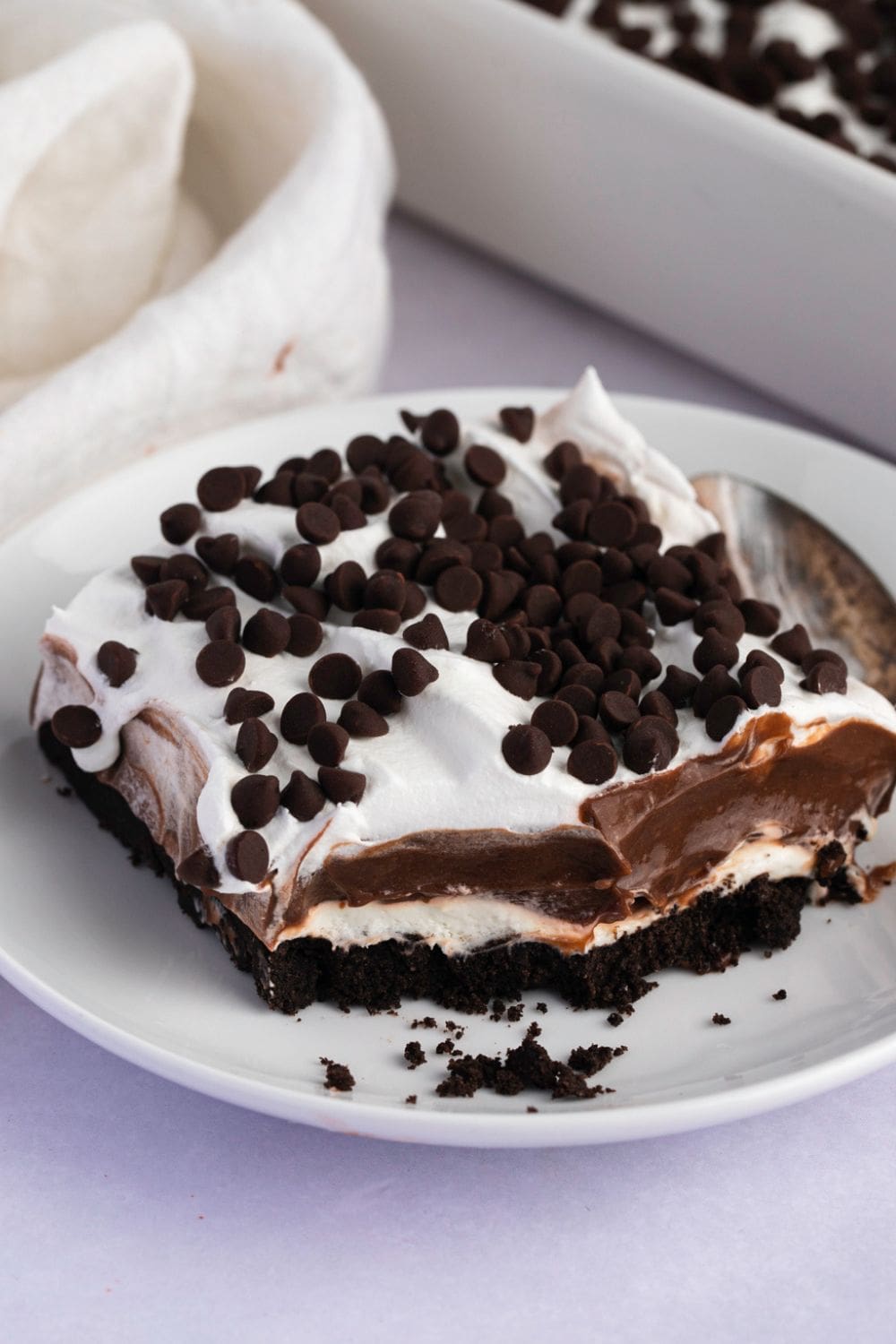 Oreo Lasagna (No-Bake Dessert Recipe) featuring Sweet Homemade Oreo Lasagna Dessert with Oreo Cookies, Chocolate Pudding Layer, Cream Cheese Layer, Whipped Cream, and Chocolate Chip Cookies