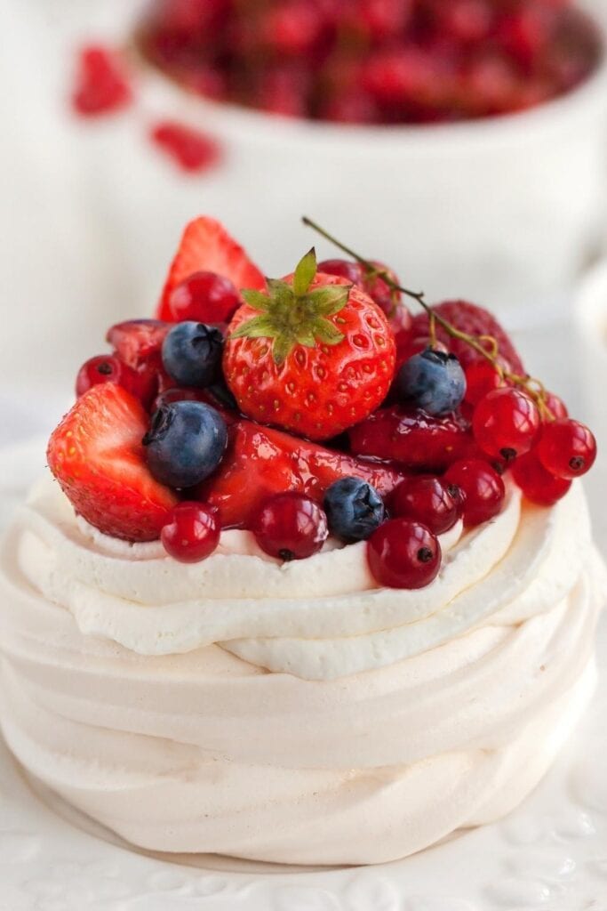 Mini Pavlova Meringue Nest with Whipped Cream, and Fresh Berries