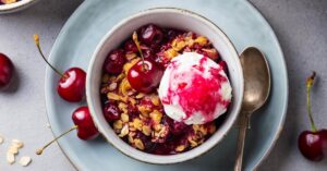 Bowl of Cherry Crisp with Ice Cream