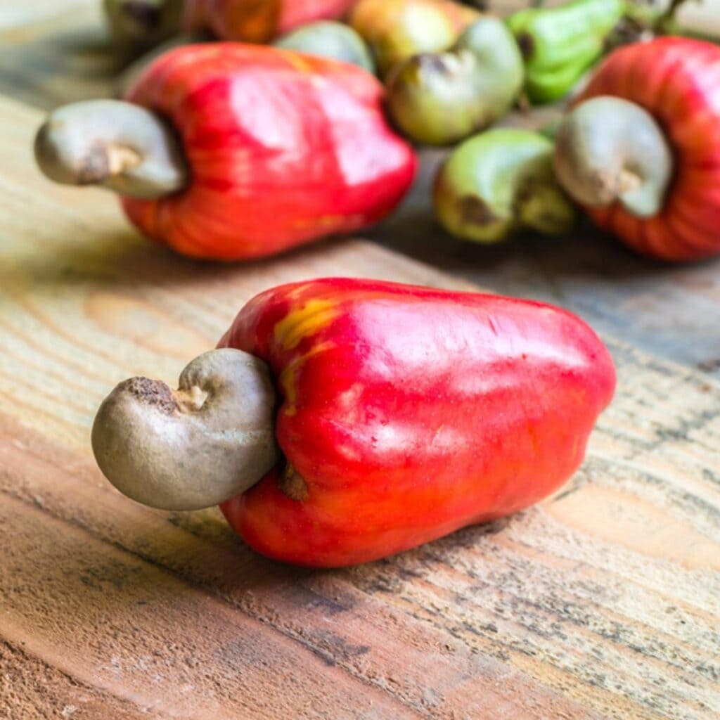 Cashew Apple Lying on a Wooden Table