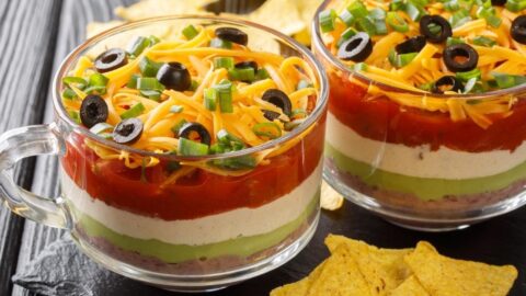 Classic Seven Layer Taco Dip with Refried Beans, Guacamole and Salsa