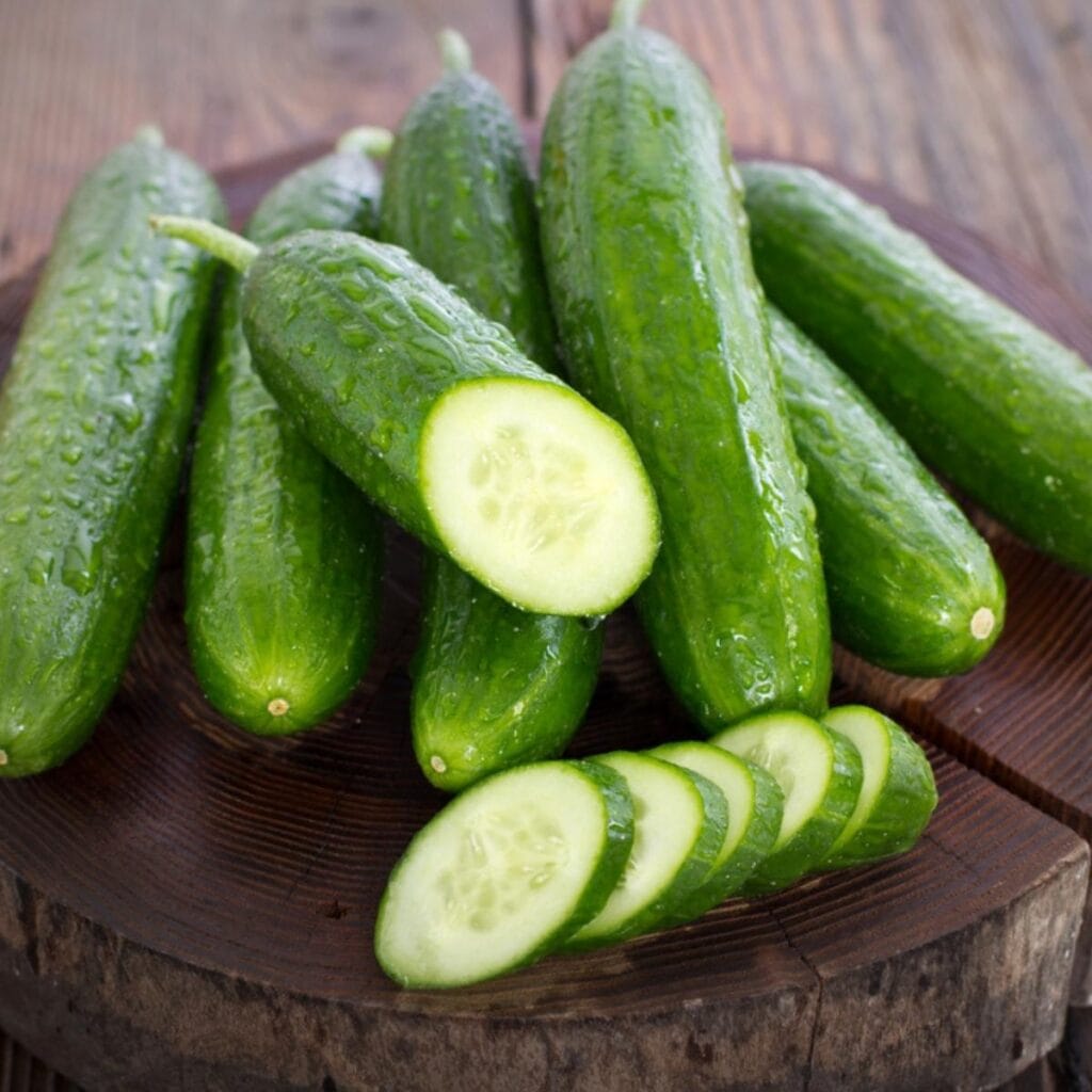 Cucumbers on Top of Wooden Chopping Board