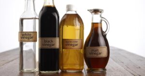 Different Vinegar in Bottles: White, Black, Apple Cider and Malt Vinegar