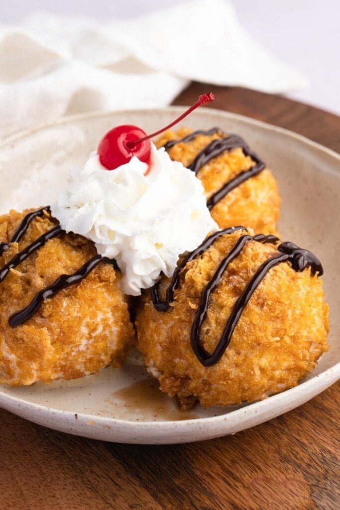 Crunchy and Creamy Fried Ice Cream with chocolate sauce and whipped cream