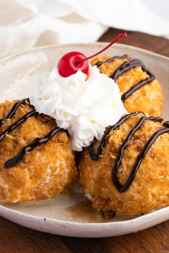 Fried Ice Cream Topped with chocolate sauce, whipped cream and Cherry