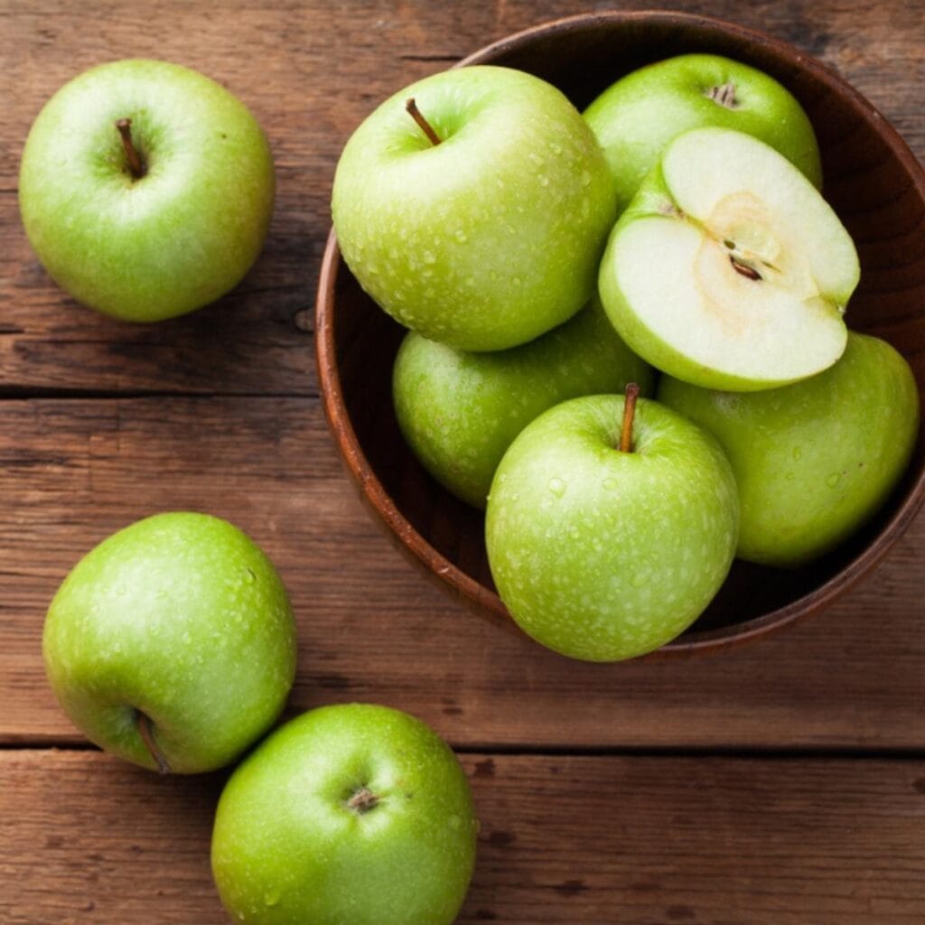 Green Apples on a Wooden Table