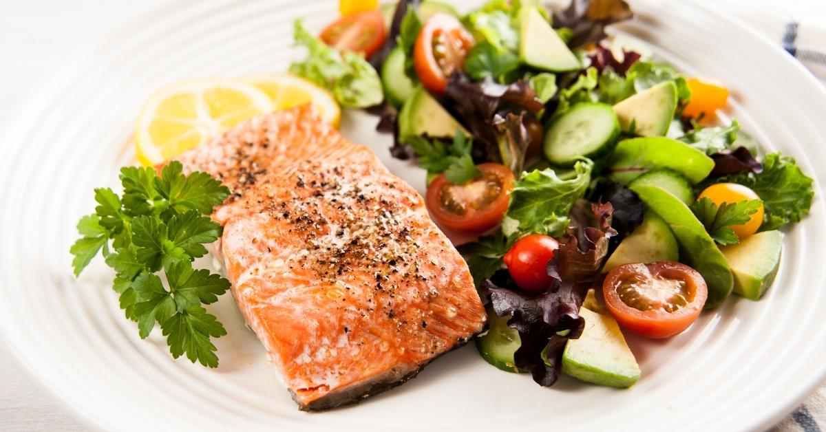 Healthy Homemade Baked Salmon with Tomatoes, Cucumber and Green Salad