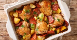 Homemade Baked Chicken Thighs with Potatoes and Chorizo Sausage in a Baking Pan