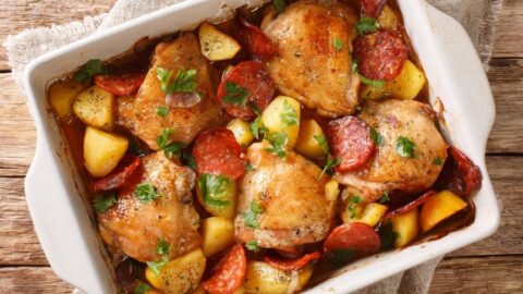 Homemade Baked Chicken Thighs with Potatoes and Chorizo Sausage in a Baking Pan