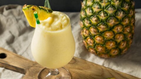 Homemade Boozy Pina Colada with Fresh Pineapple Slice