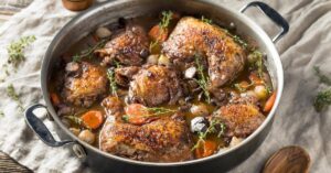 Homemade French Coq Au Vin Chicken with Sauce and Vegetables