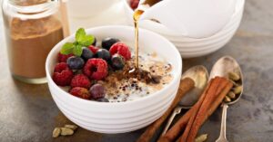 Homemade Quinoa Breakfast Porridge Bowl with Raspberries and Blueberries