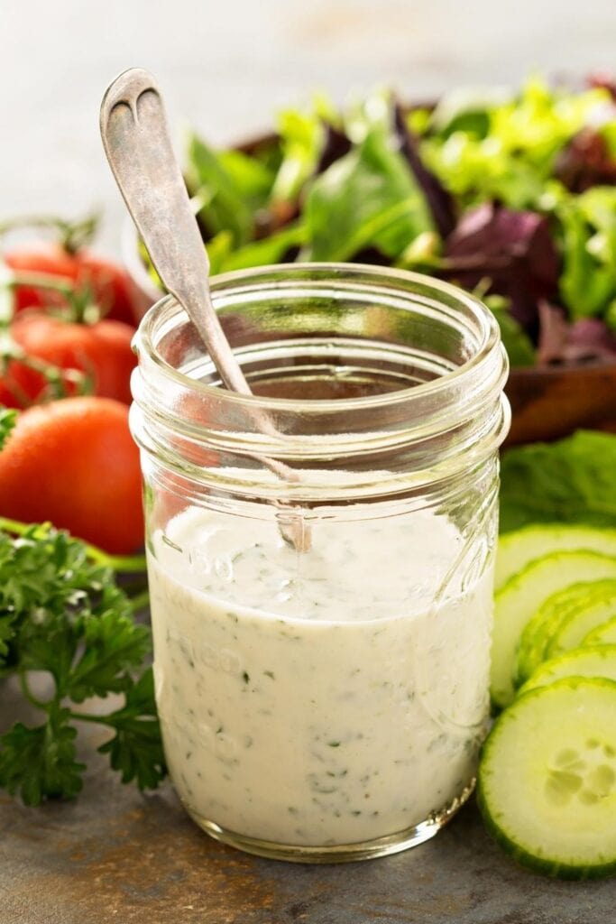 Homemade Vegan Ranch Dressing in a Mason Jar with Vegetables