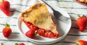 Homemade Strawberry Rhubarb Pie in a White Plate