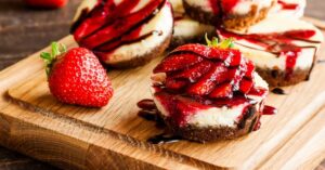 Homemade Sweet Chocolate Cheesecake with Fresh Strawberries and Chocolate Sauce