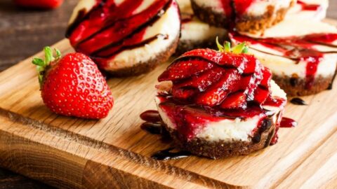 Homemade Sweet Chocolate Cheesecake with Fresh Strawberries and Chocolate Sauce