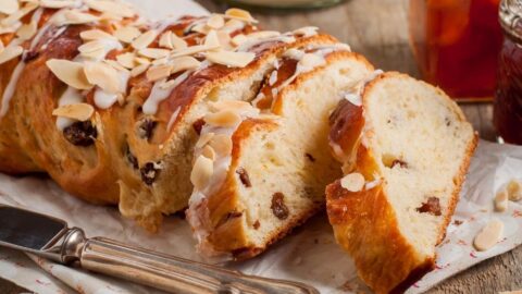 Homemade Sweet Sliced Braided Bread with Flaked Almonds and Raisins