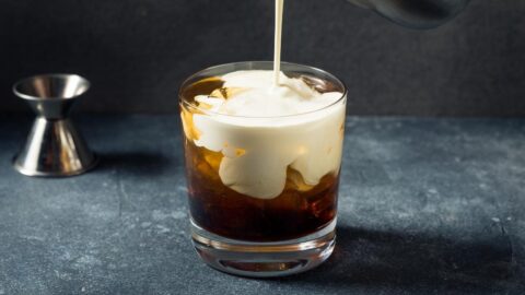 Homemade White Russian Cocktail with Butterscotch Schnapps in a Glass