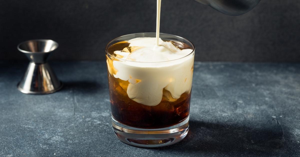 Homemade White Russian Cocktail with Butterscotch Schnapps in a Glass