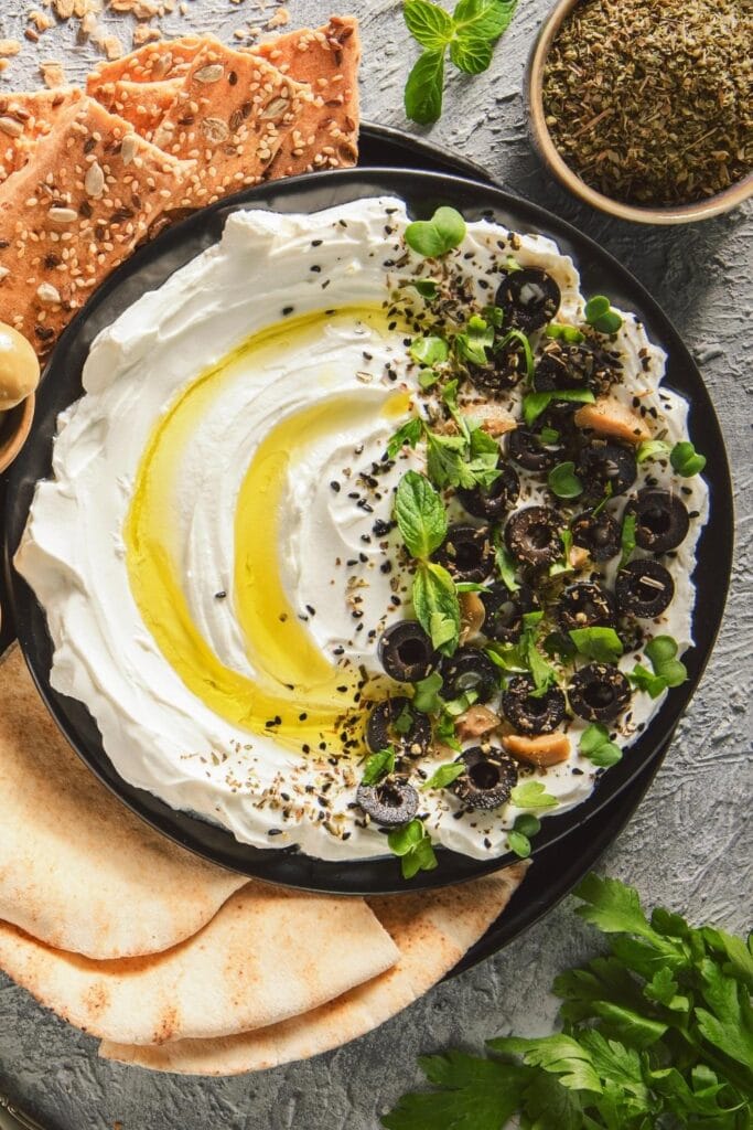 Labneh Yogurt Dip with Herbs, Olives, Oil and Pita Bread