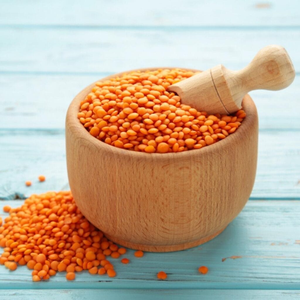 Brown Wooden Bowl Filled with Lentils 