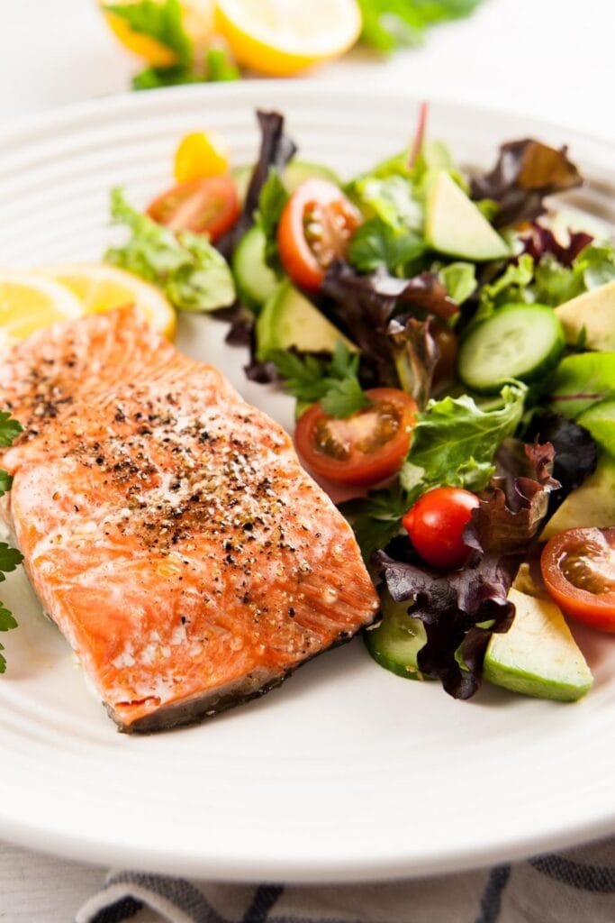 Paleo Baked Salmon with Tomatoes, Cucumber, Avocados and Green Salad