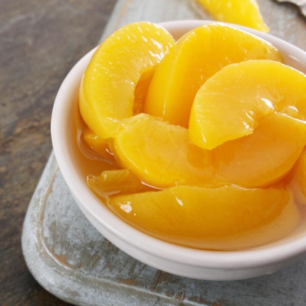 Bowl of Peaches With Syrup